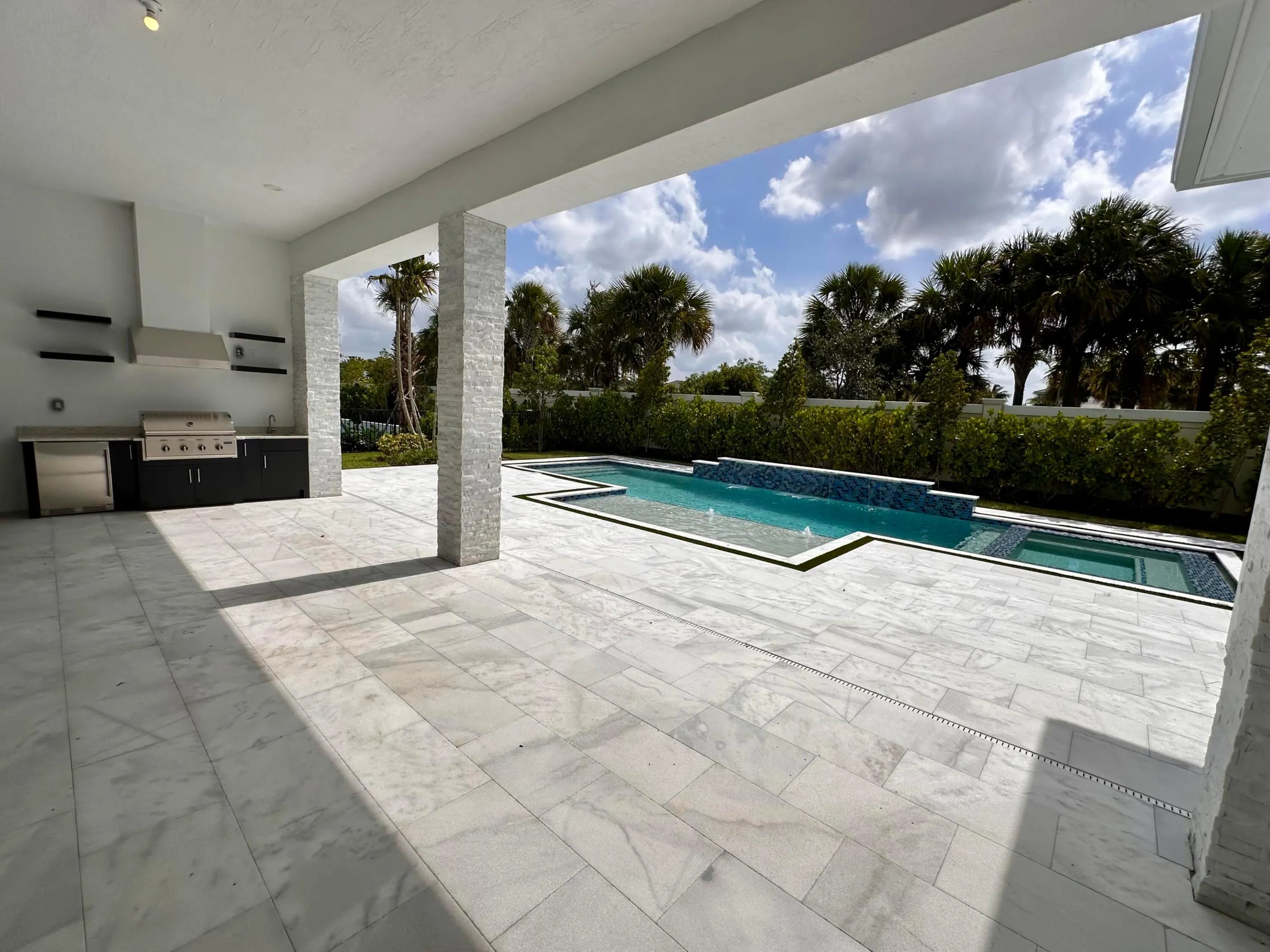 Oversized Covered Lanai finished with beautiful Summer Kitchen