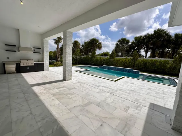 Oversized Covered Lanai finished with beautiful Summer Kitchen