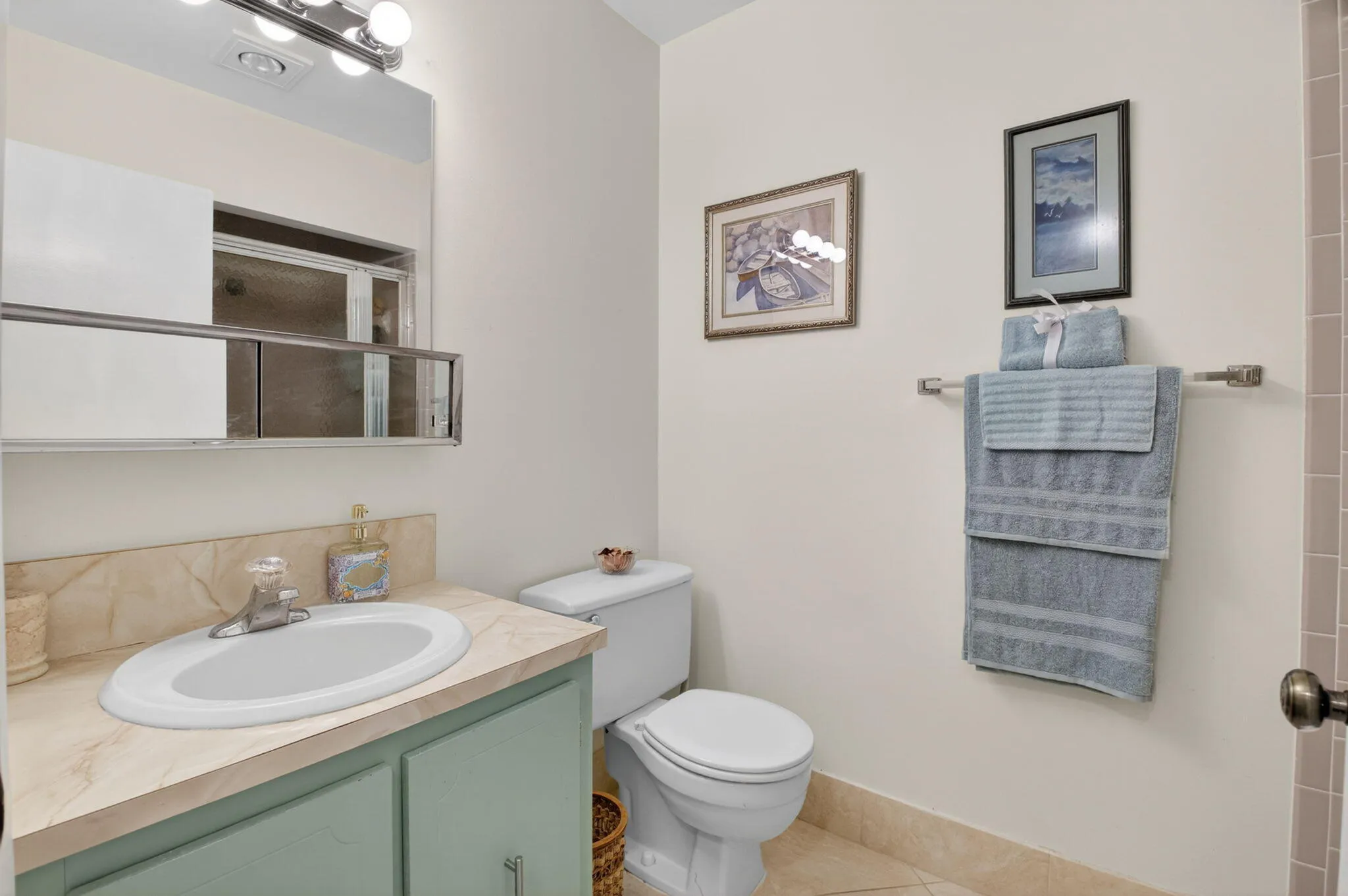 Guest bathroom with walk-in showerm (behind door)