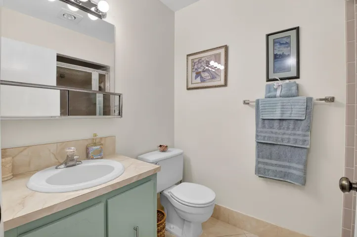 Guest bathroom with walk-in showerm (behind door)