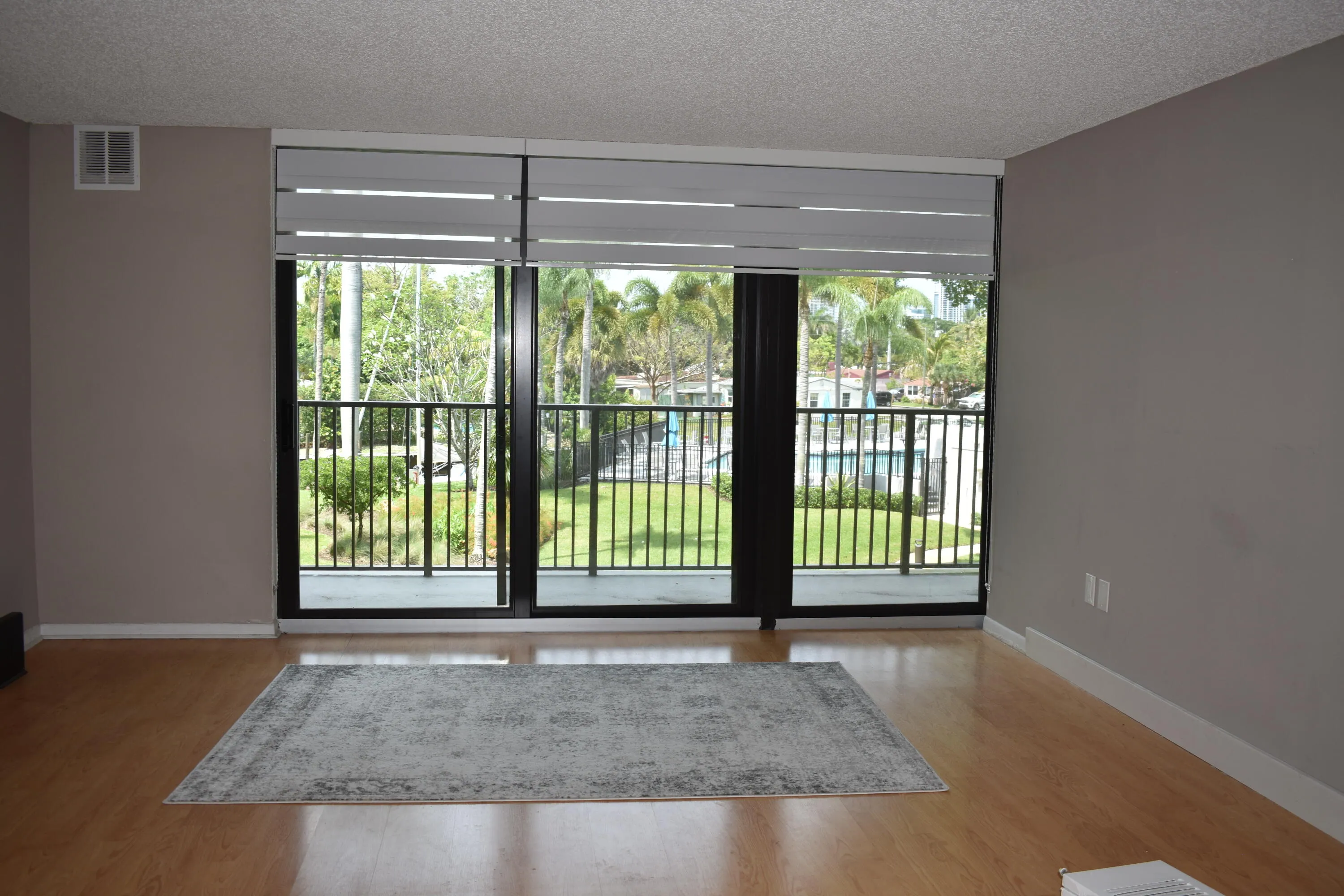 New impact sliding glass doors from living room to balcony