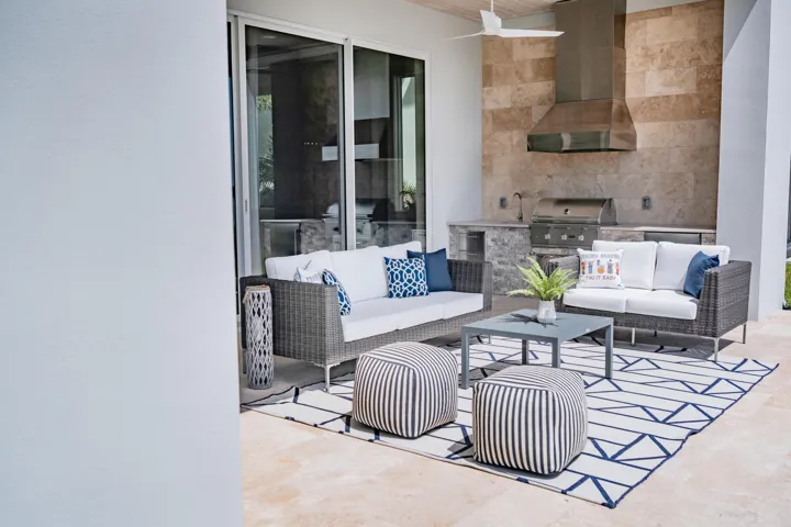 Amazing covered lanai complete with summer kitchen, seating area, fire pit, fire features and putting green with gorgeous river views.