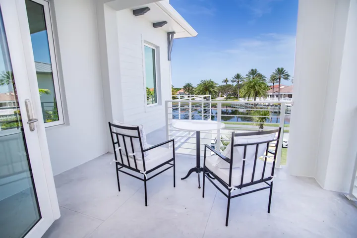 Private second-floor covered balcony: the ultimate vantage point for tranquil morning coffees and stunning evening sunsets.