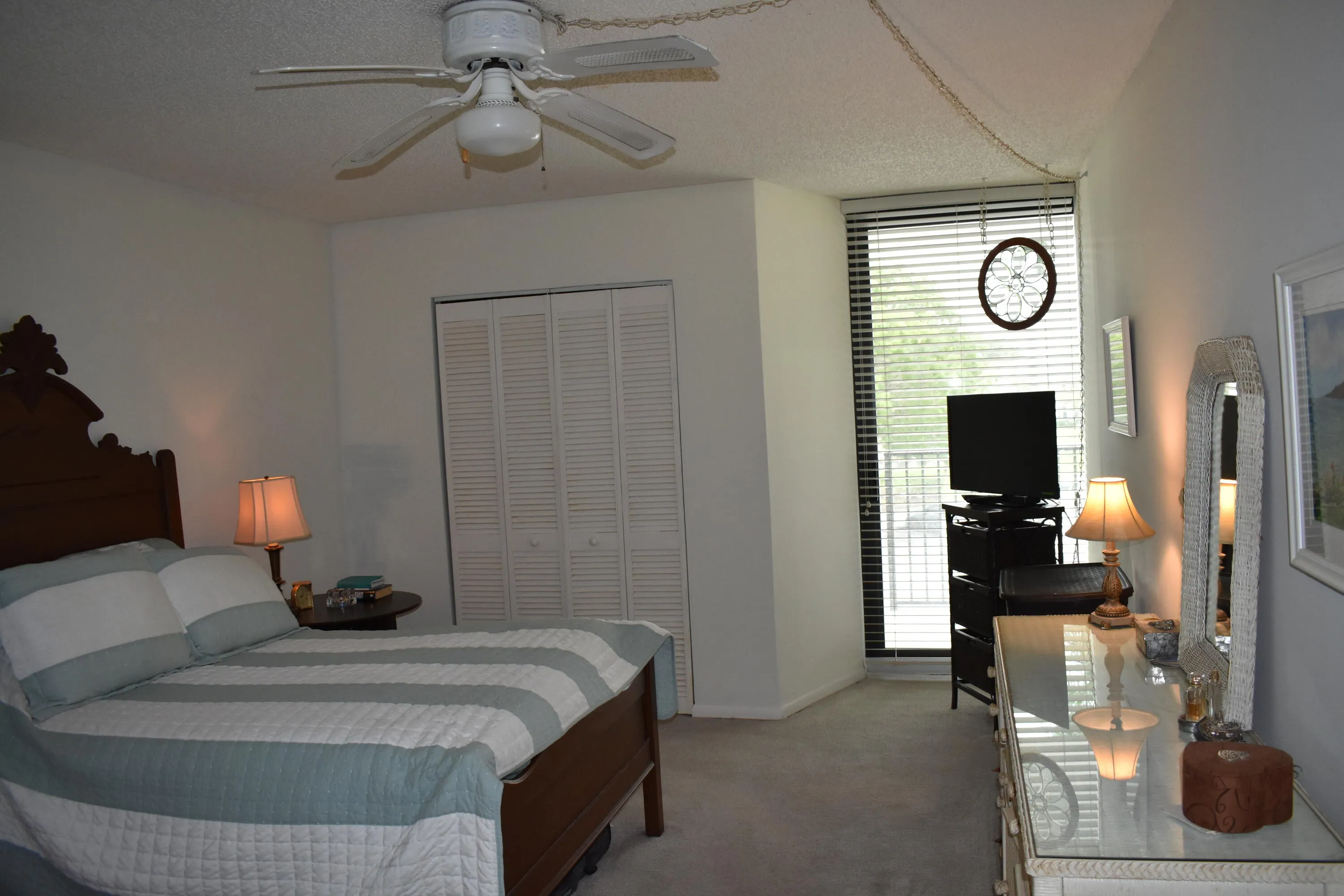 Primary Bedroom with impact sliding glass door to balcony
