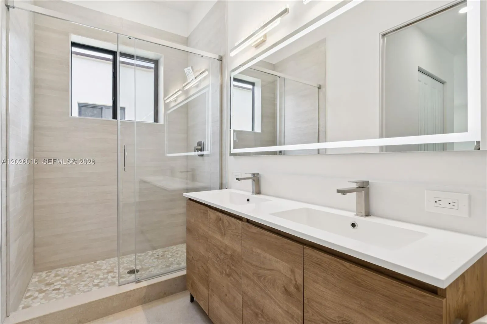 Photos shown are of a completed unit with the same layout and styling; the available unit is currently under construction and may vary.