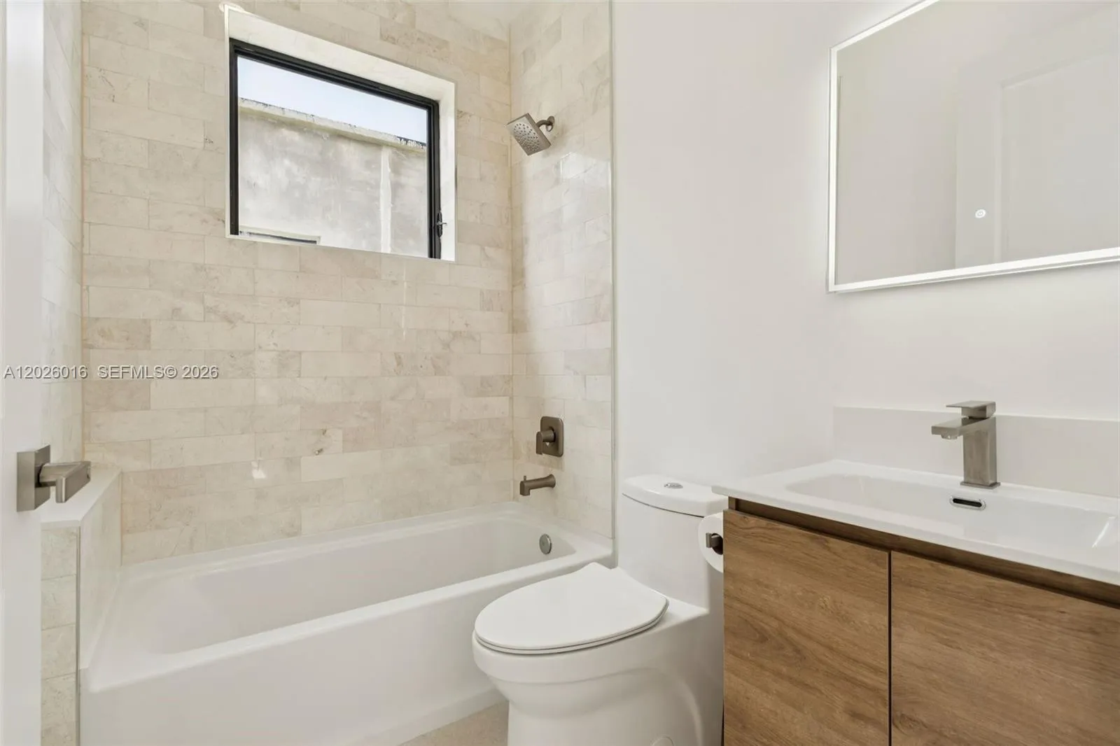Photos shown are of a completed unit with the same layout and styling; the available unit is currently under construction and may vary.