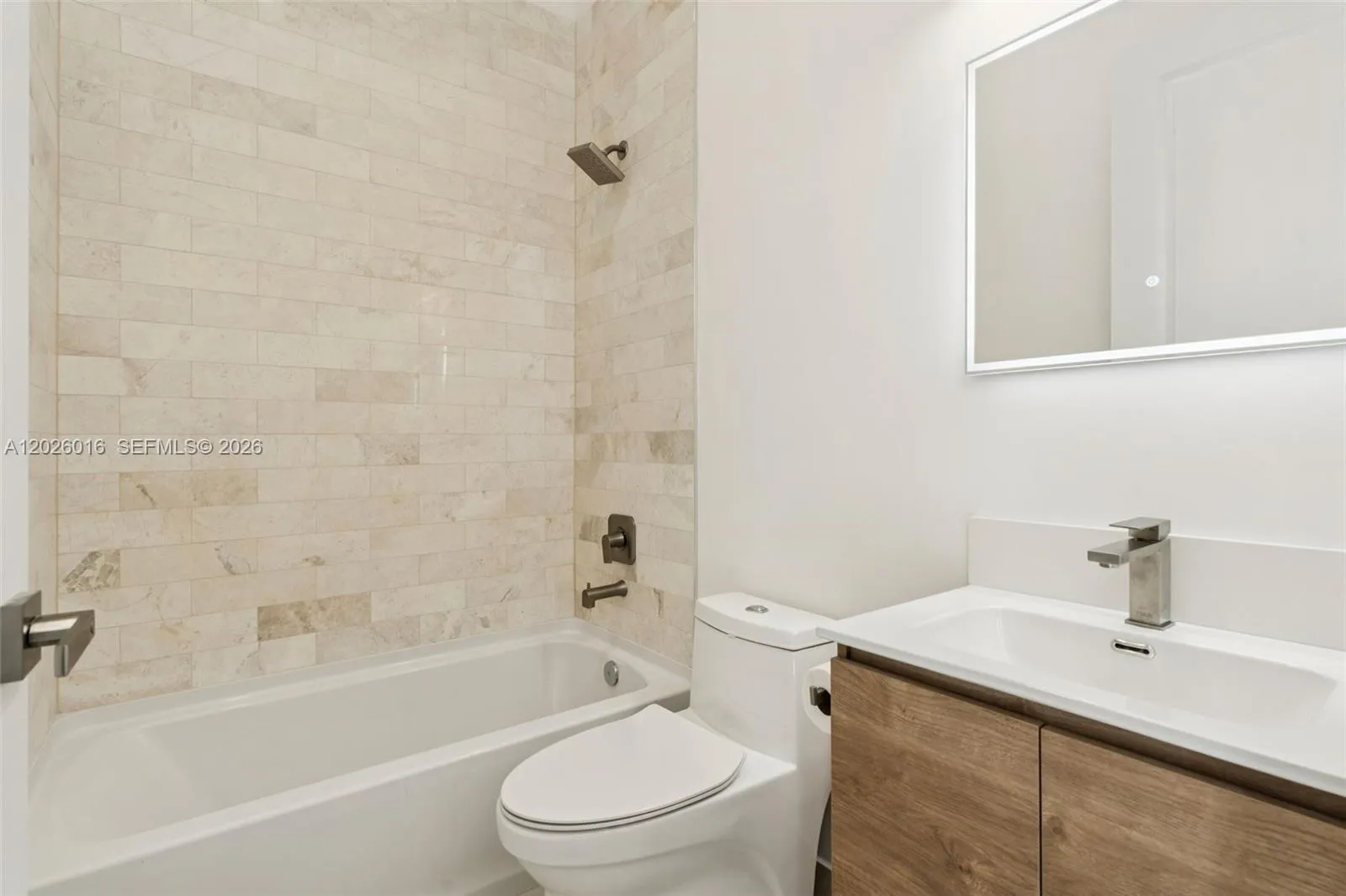 Photos shown are of a completed unit with the same layout and styling; the available unit is currently under construction and may vary.