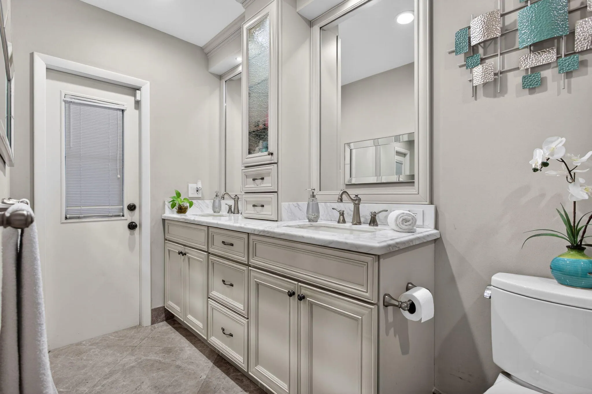 Double sinks and cabana bathroom.