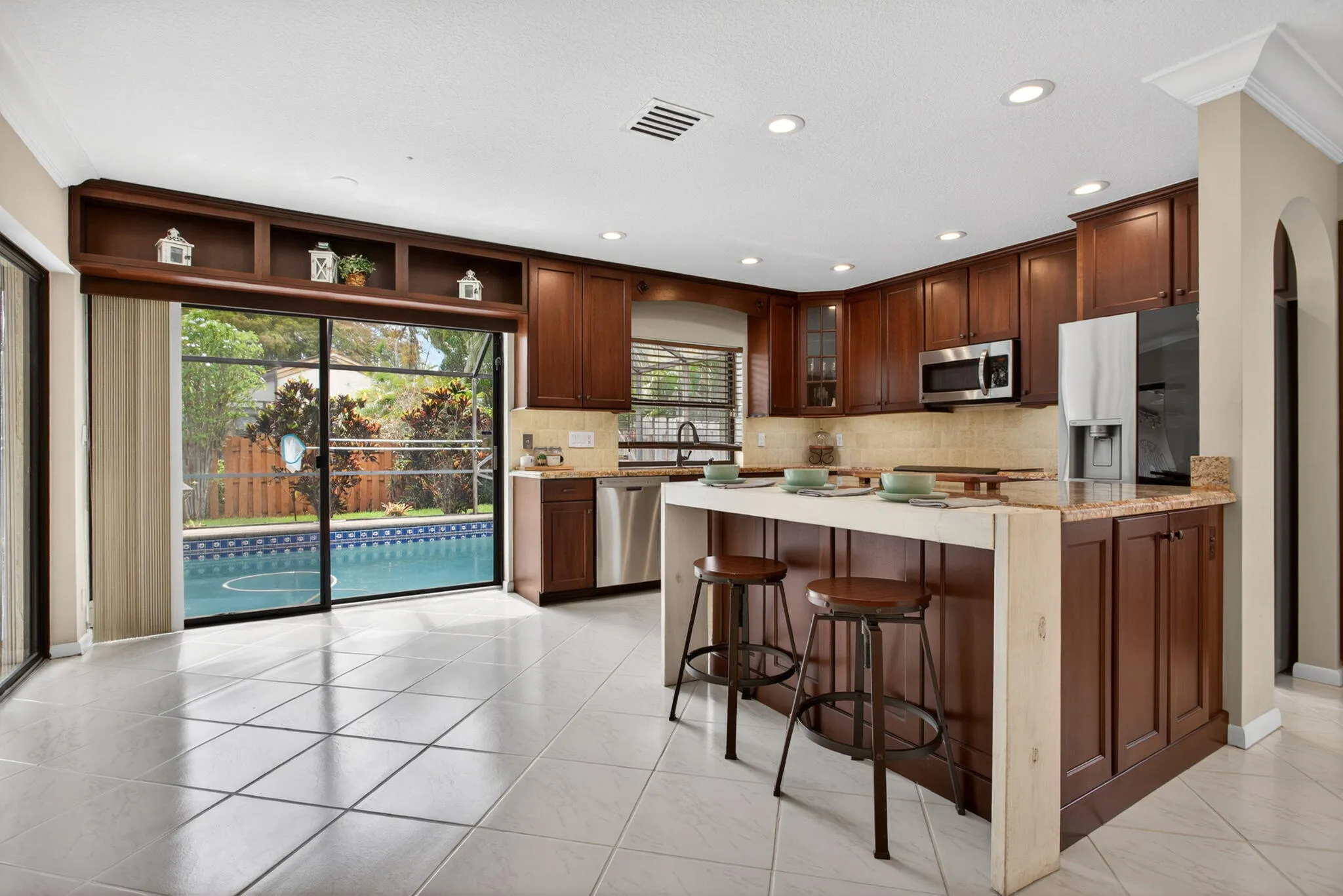 Custom wood cabinets and beautiful stone counters, make this a true masterpiece.