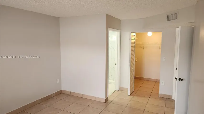 Master Bedroom-walk-in closet + bath entry