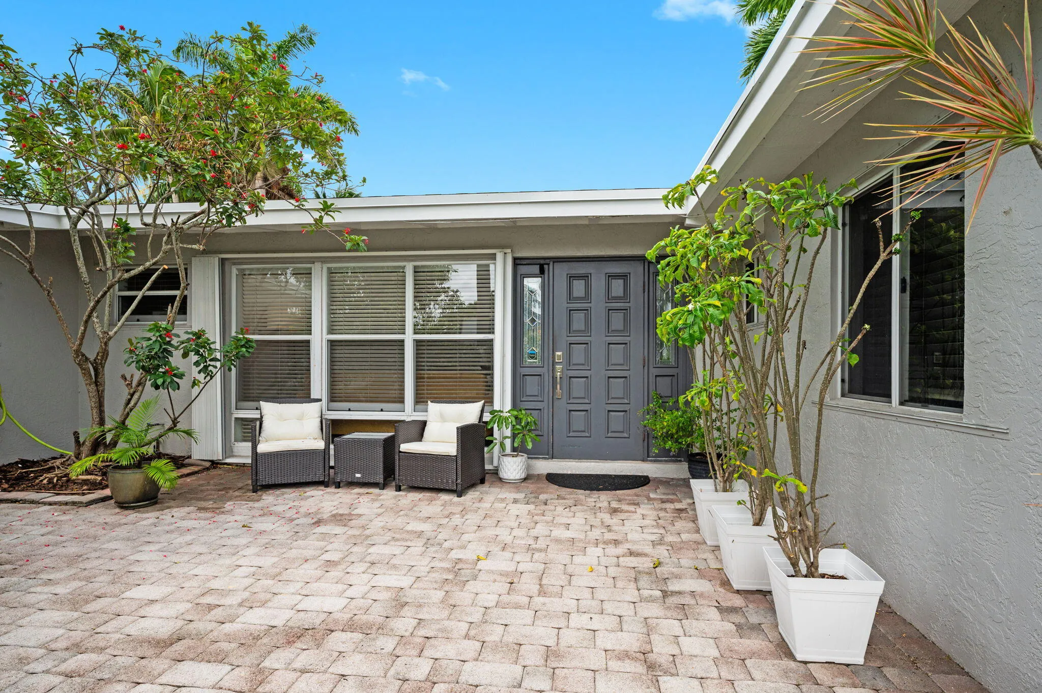 Front entry with pavers and seating area