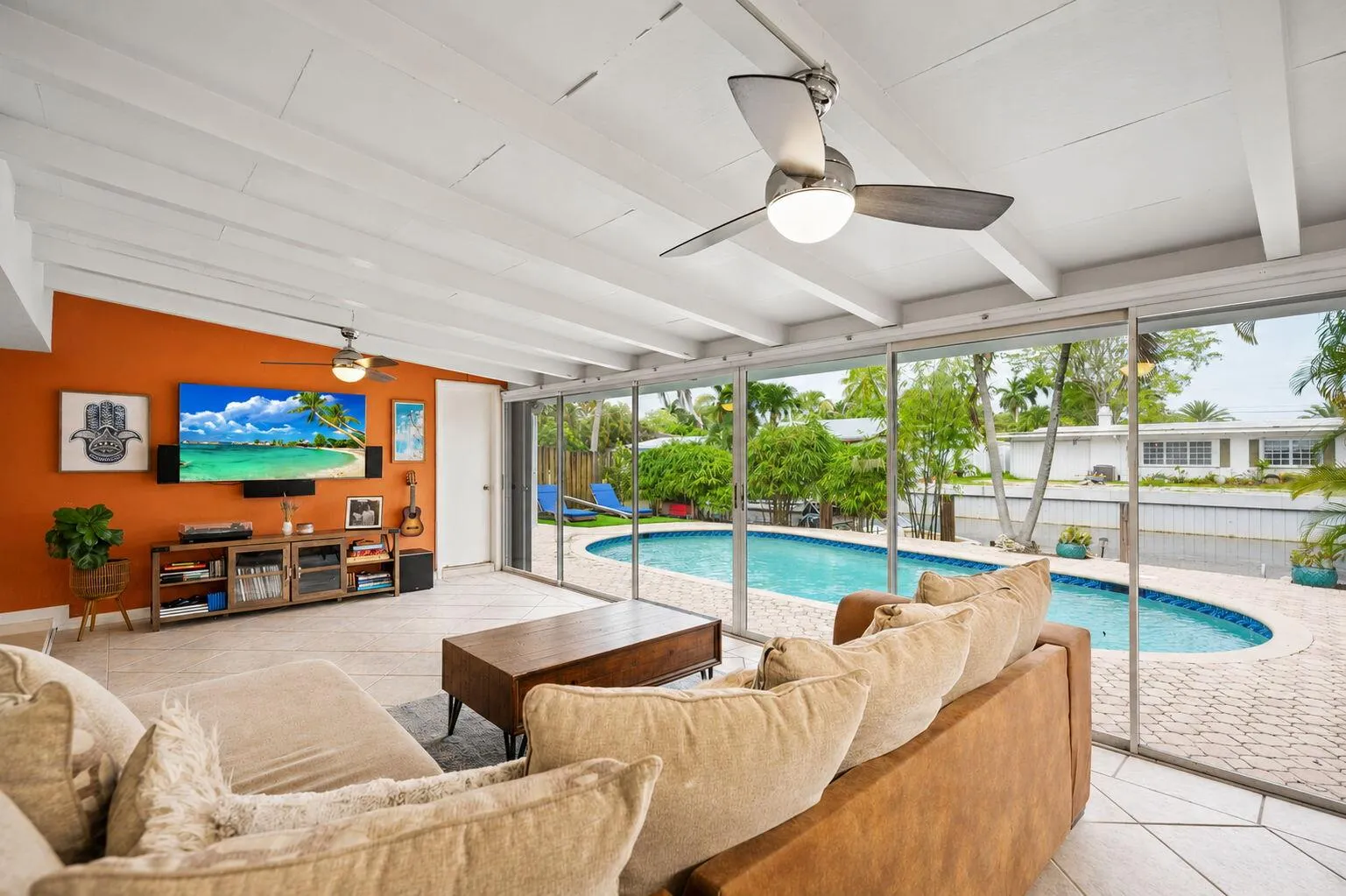 The Florida room has a wall of sliding glass doors.