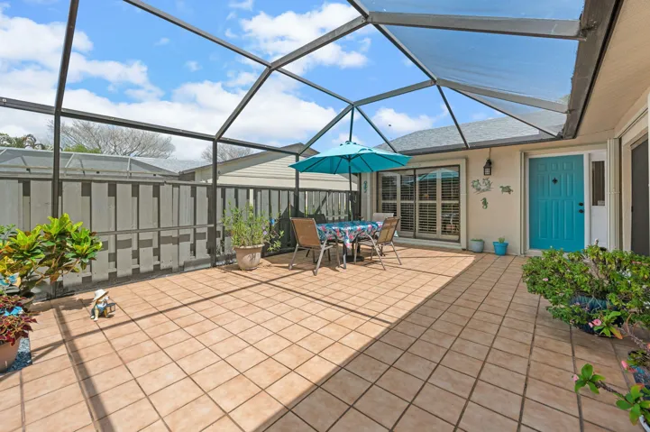 570 sqft enclosed lanai with tile flooring that stays cool