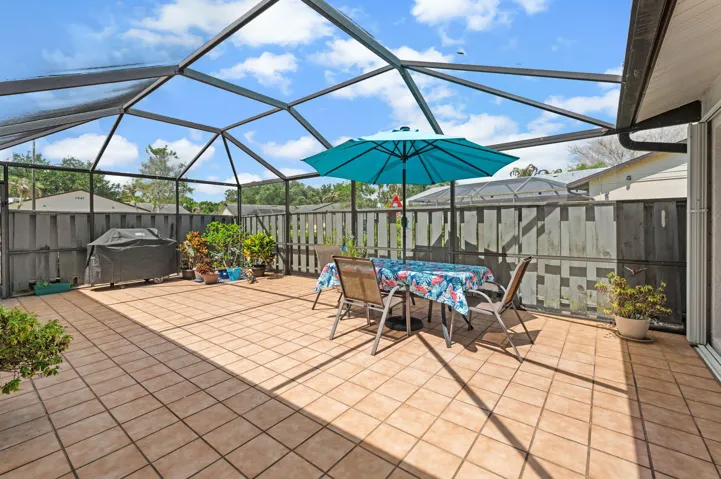 570 sqft enclosed lanai with tile flooring that stays cool