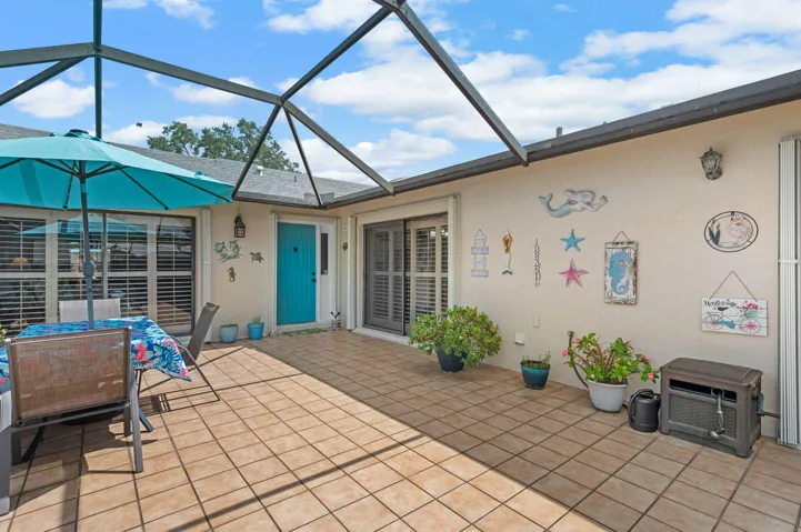 570 sqft enclosed lanai with tile flooring that stays cool