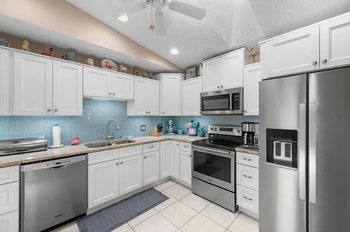 Beautifully updated kitchen with stunning quartz countertops