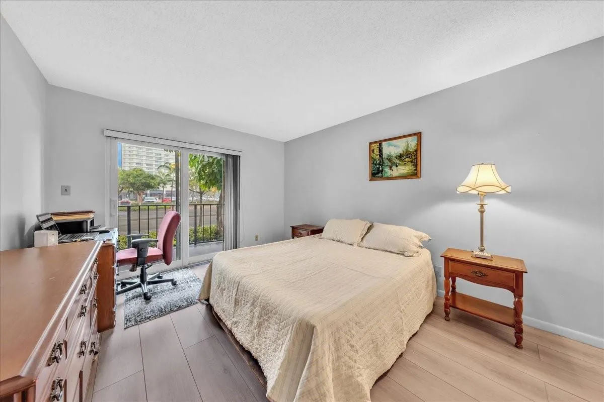primary bedroom with balcony, Fort Lauderdale condo bedroom, coastal living, sliding glass doors, natural light bedroom, Top of the Mile residences