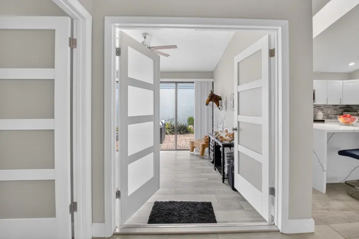 PANEL DOORS LEAD ONTO FLORIDA ROOM