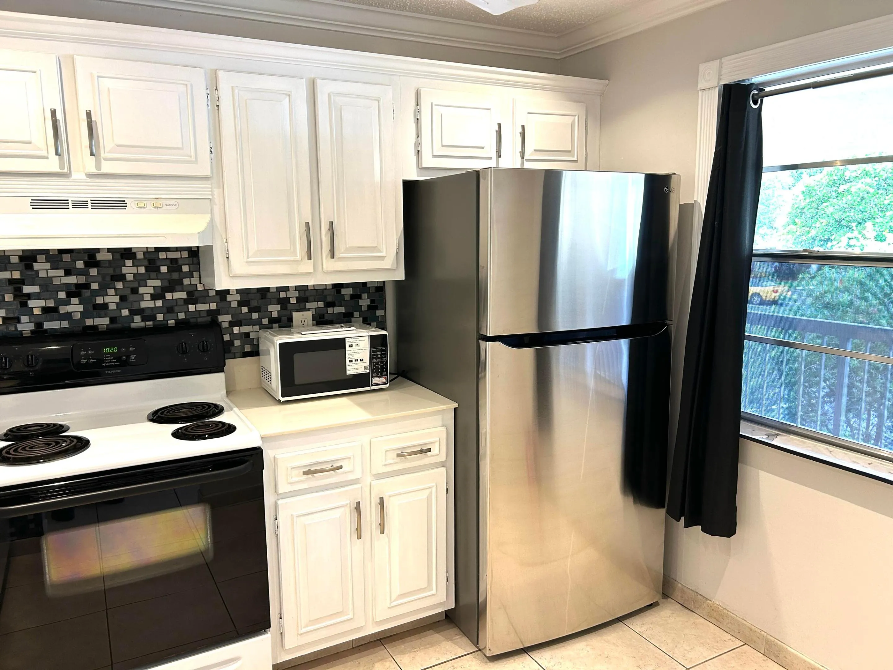 Kitchen with newer refrigerator...approximately 2 years old.