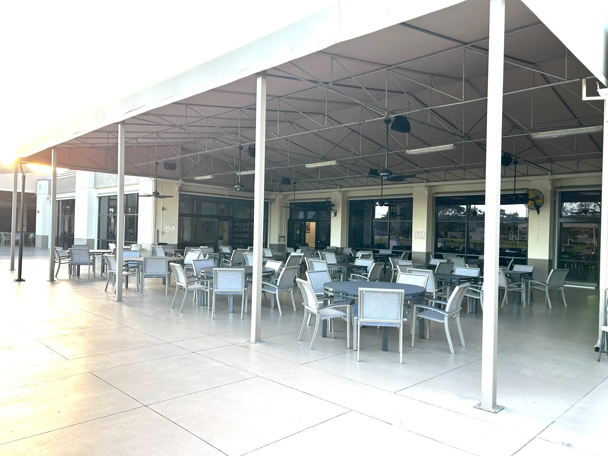 Covered area outside the clubhouse is used for gatherings and overlooks the golf course.