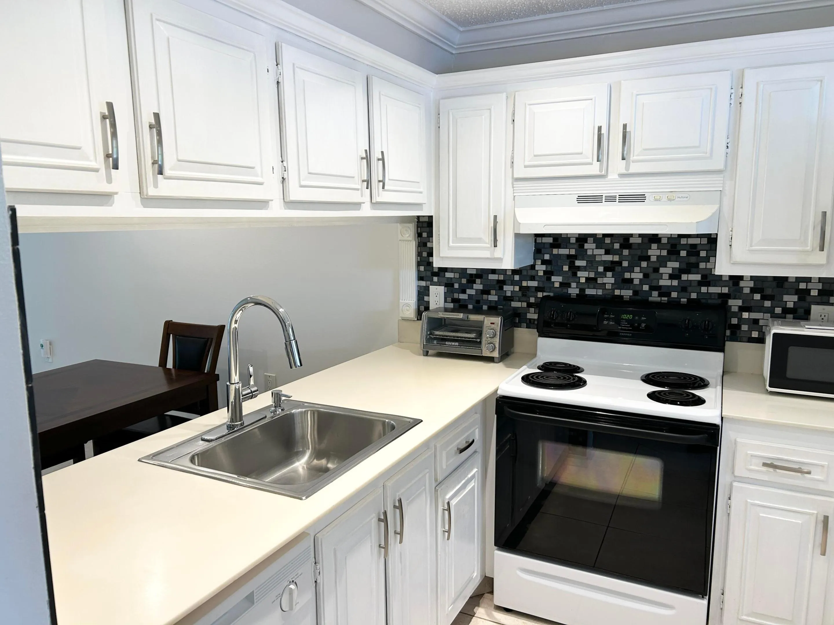 Kitchen with newer faucet.