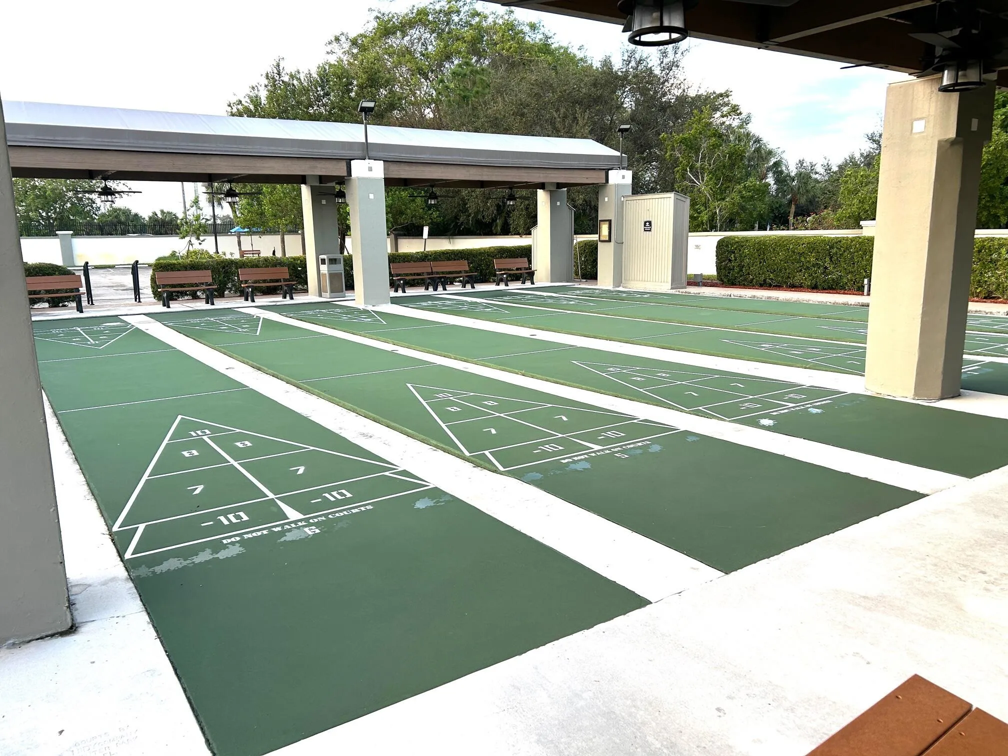 Shuffleboard is next to the Wynmoor main pool and fitness center.