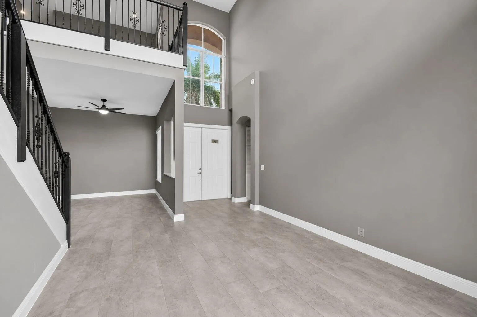 Entryway with primary suite to the right and dining room to the left