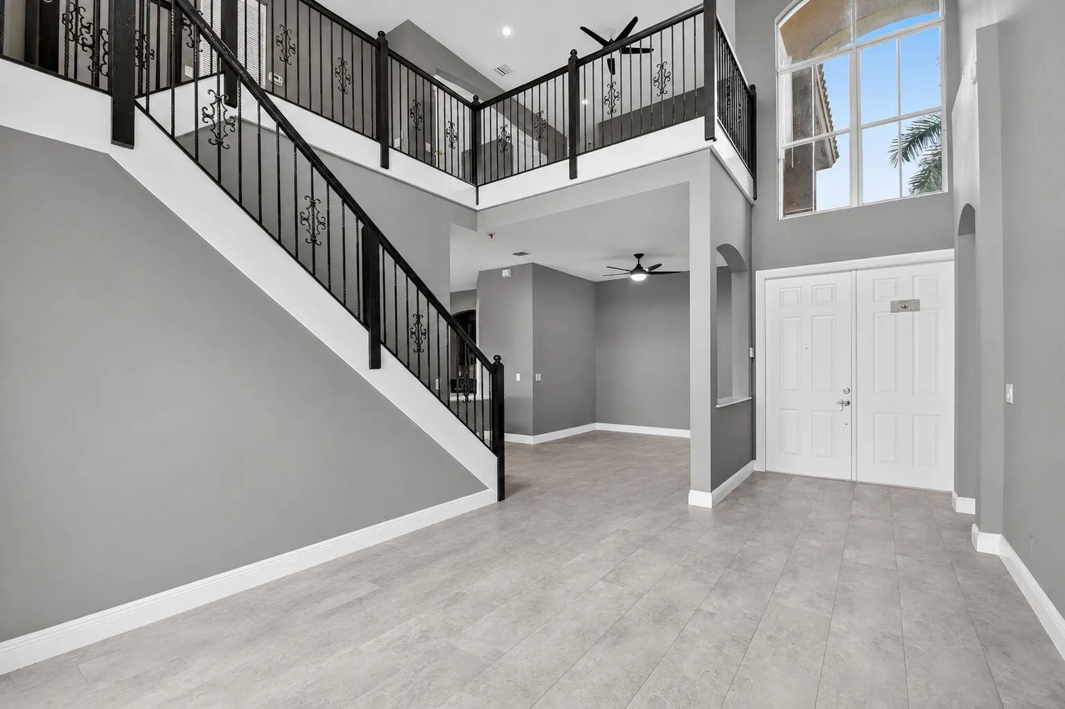 Open and airy living and dining areas with loft above