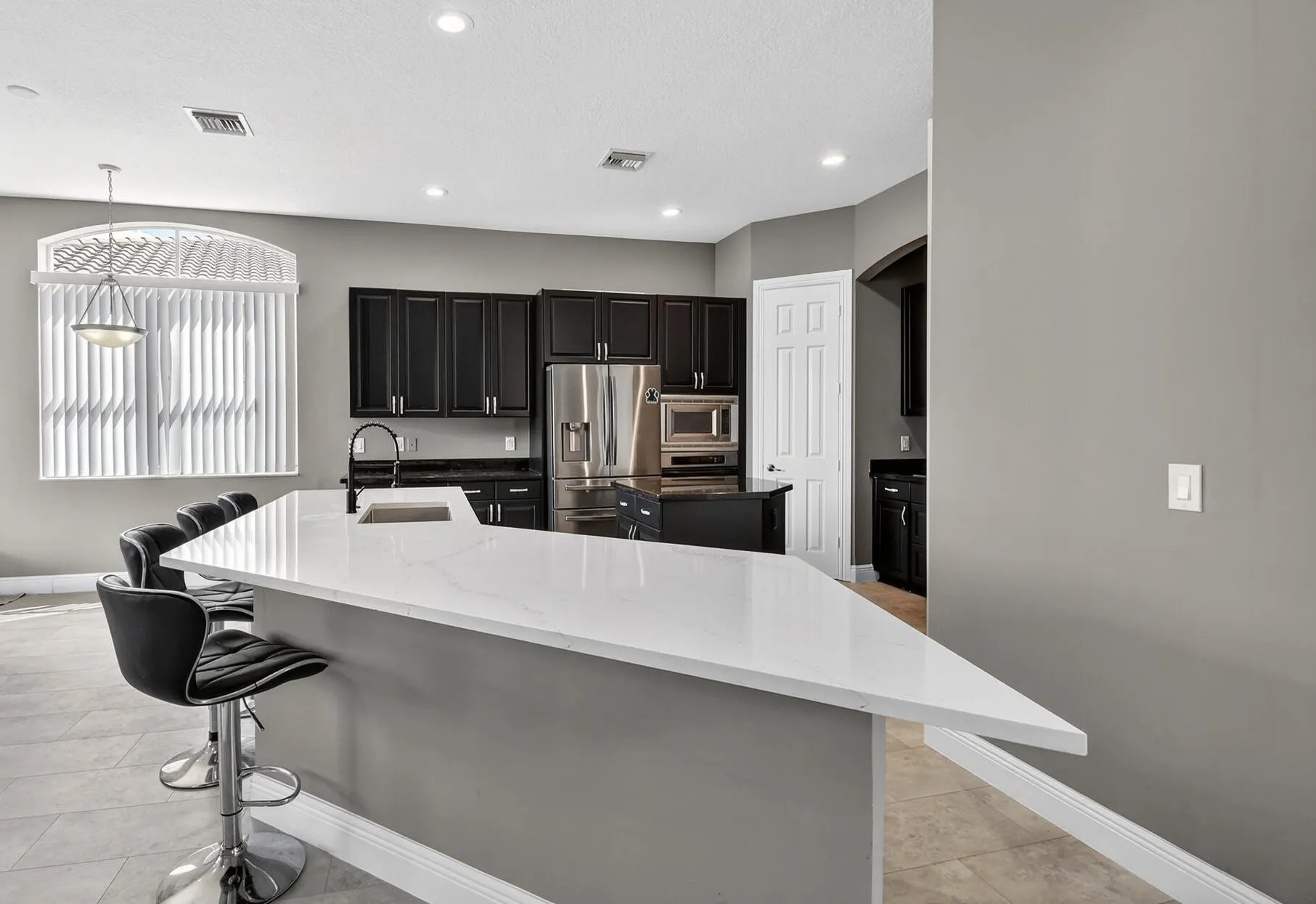 Huge kitchen island with plenty of prep, serving and seating space