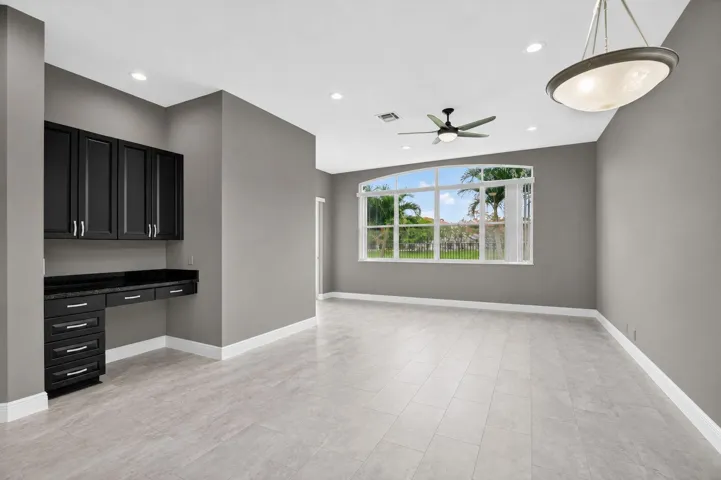 Built-in desk between kitchen and family room