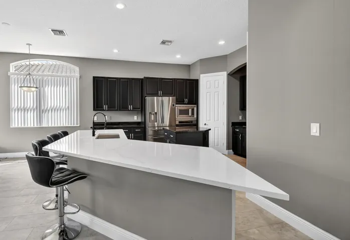 Huge kitchen island with plenty of prep, serving and seating space