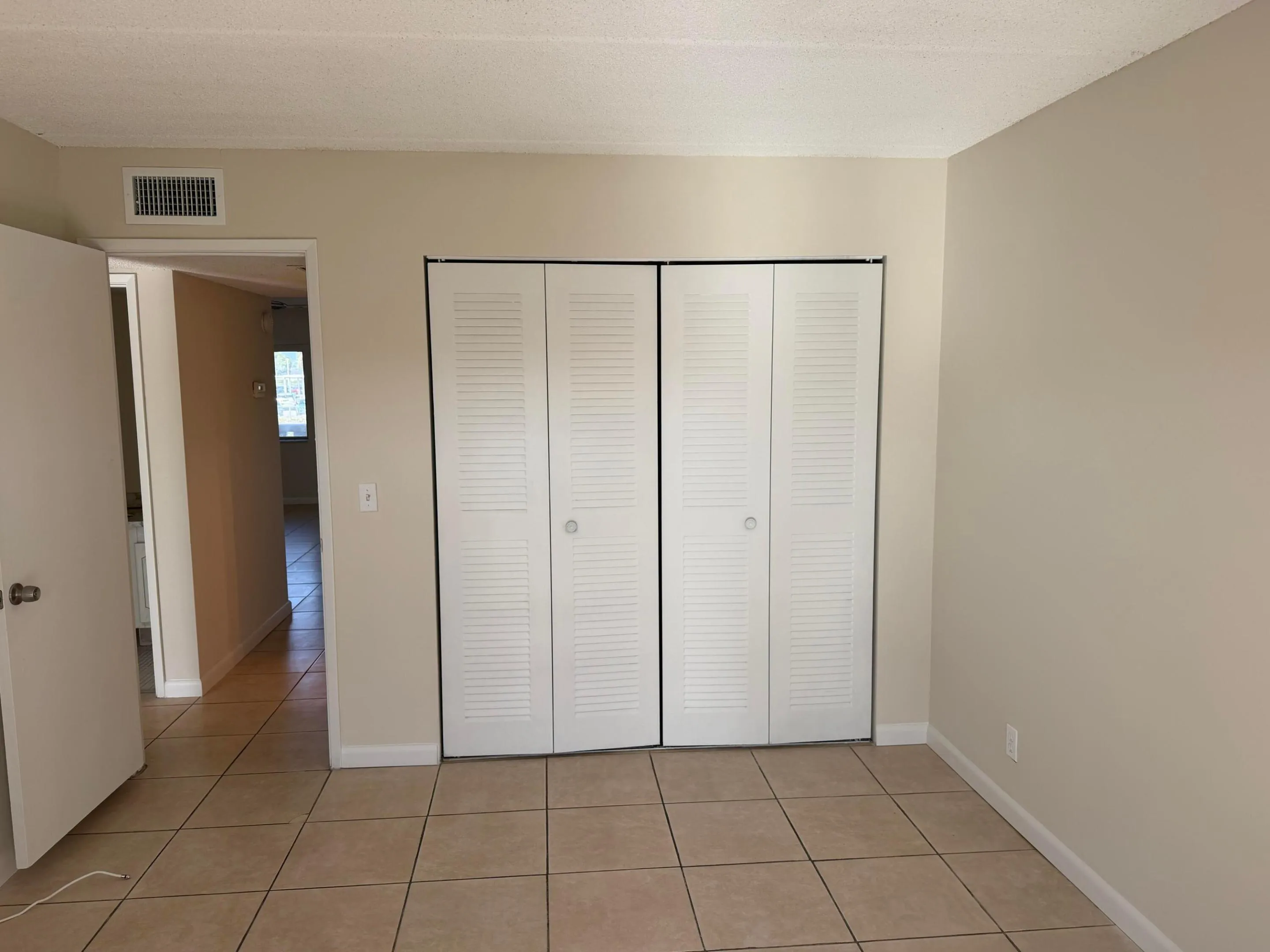 Guest bedroom has wall closet