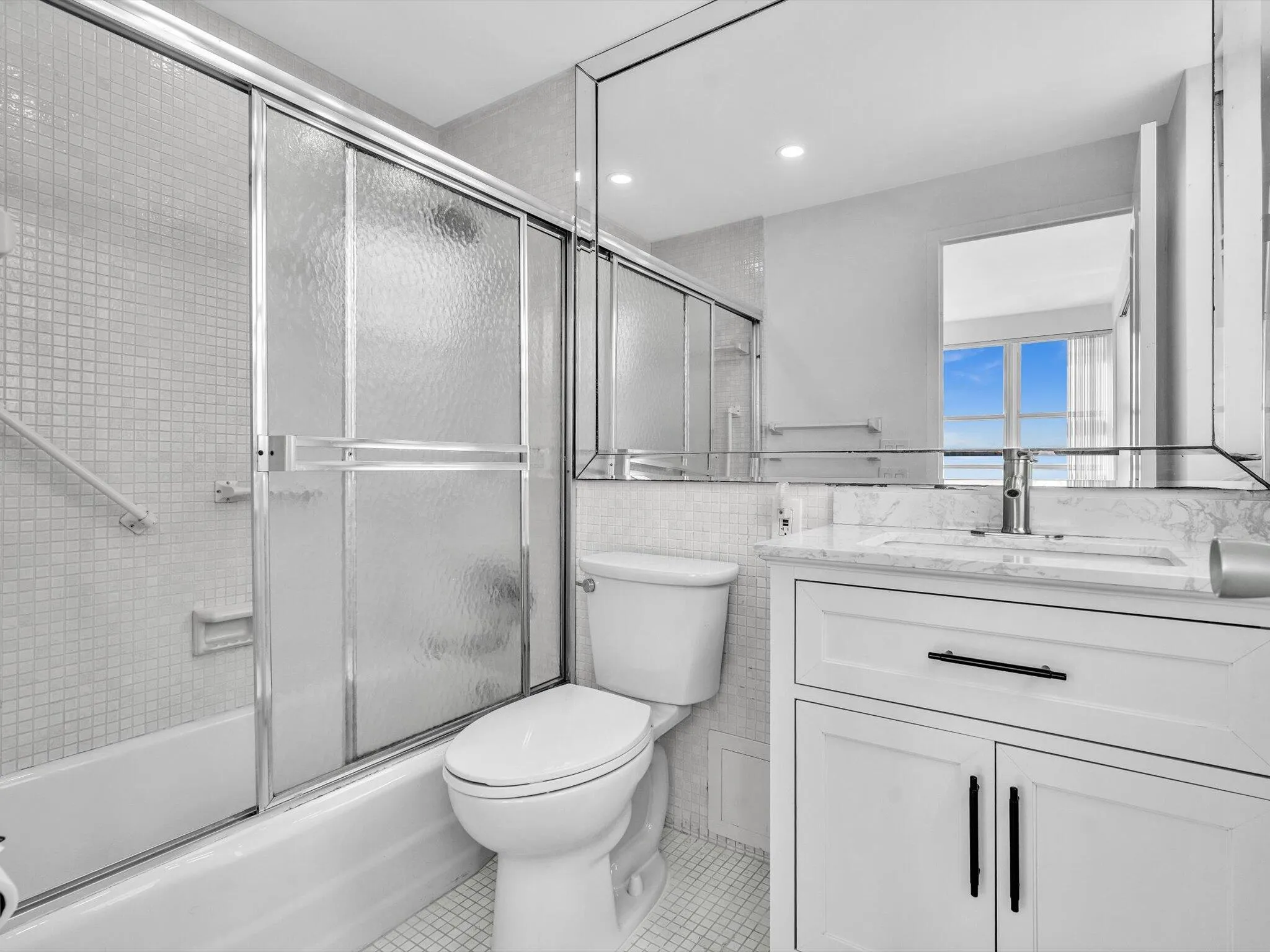 Primary bathroom with tub and shower