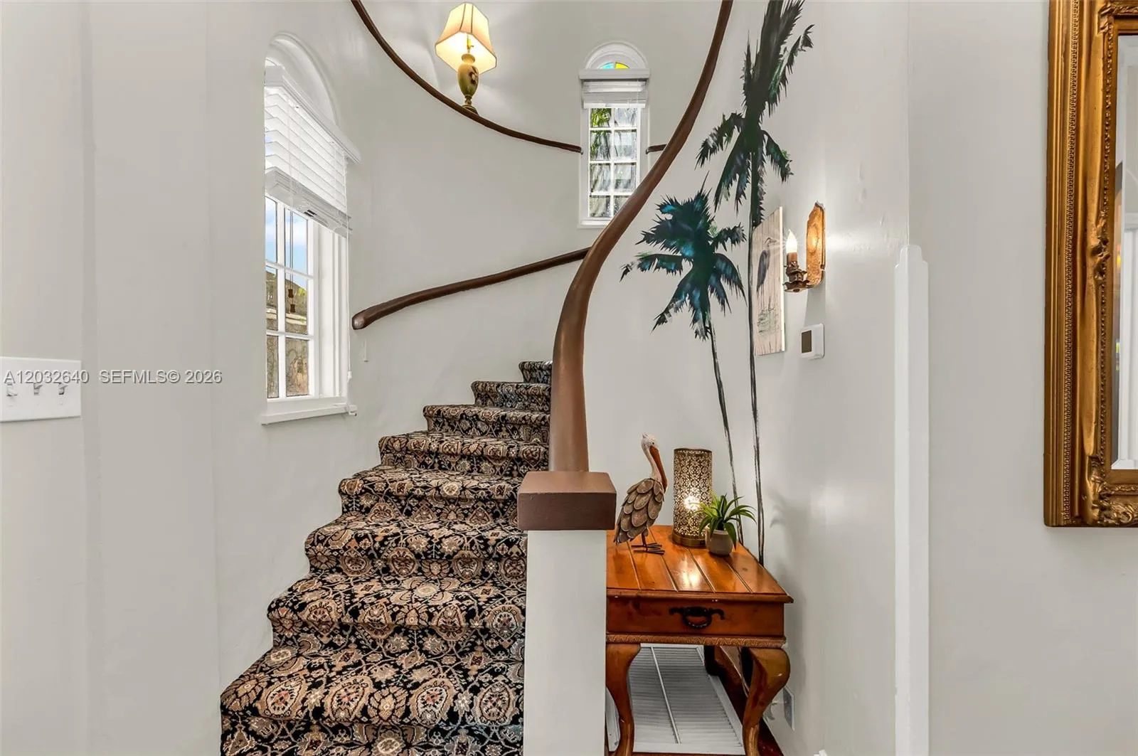 Staircase leading to second floor of main house.