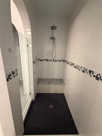 WALK IN SHOWER WITH CUSTOM BENCH.