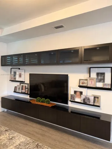 LOFT HAS A FLOATING TV / STORAGE UNIT