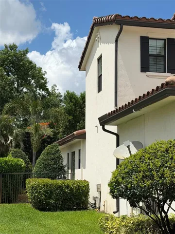 LEFT SIDE OF HOME, FENCE LEADING TO BACK YARD.