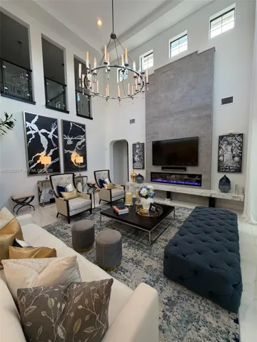 DESIGNER GLASS RAILINGS OPEN TO THE SECOND FLOOR.