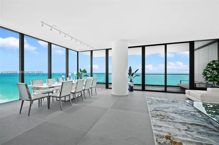 Direct ocean views from the spacious ldining area with floor-to-ceiling glass.