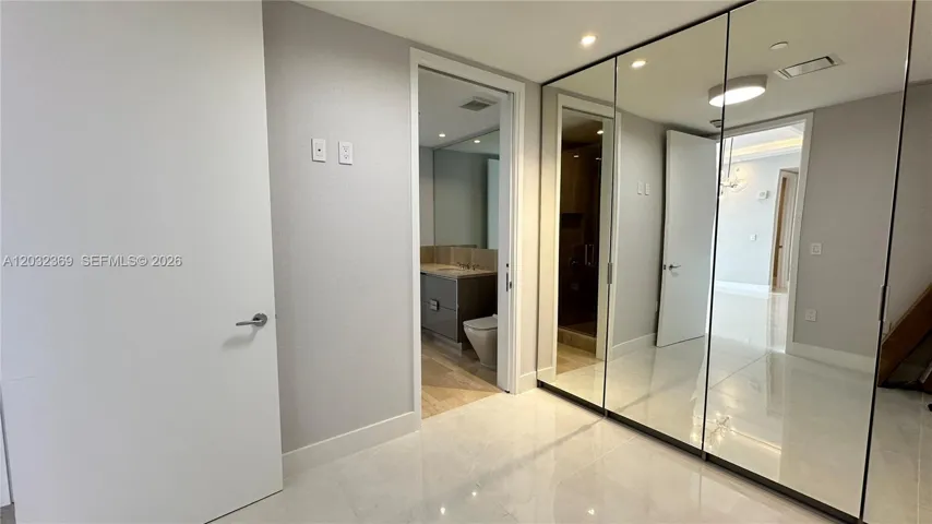 Closed Den with entrance to secondary bathroom.