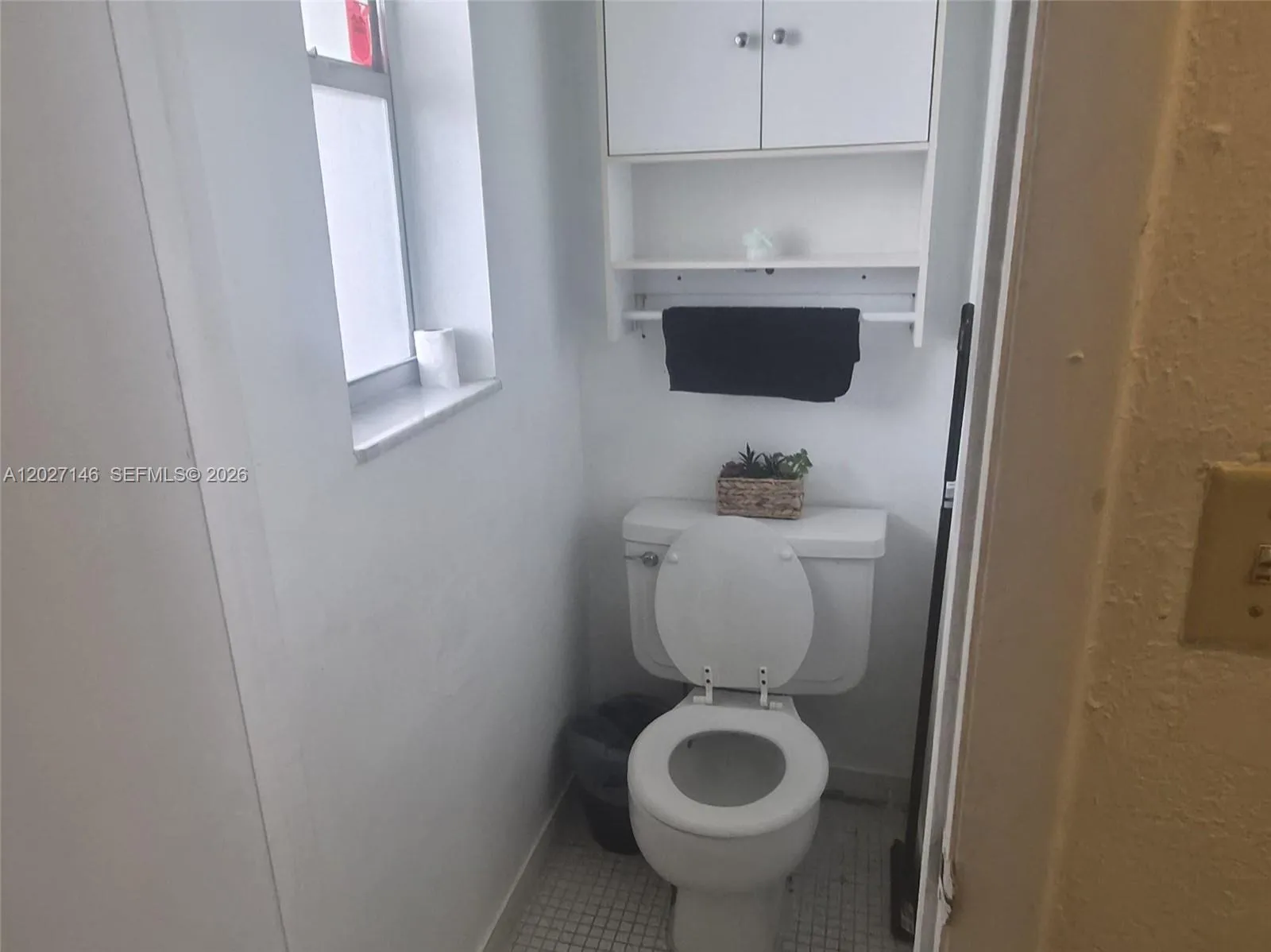 Convenient guest half-bathroom—a highly sought-after secondary layout feature for 1-bedroom models
