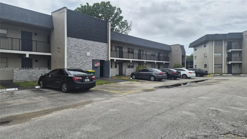 Welcome to Building 6 at Versailles Gardens, featuring assigned resident parking right at your front entrance