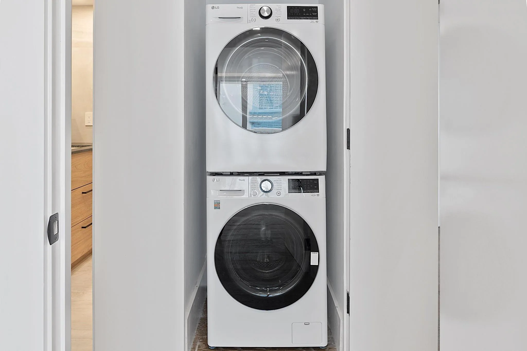 Brand new washer and dryer in hallway closet