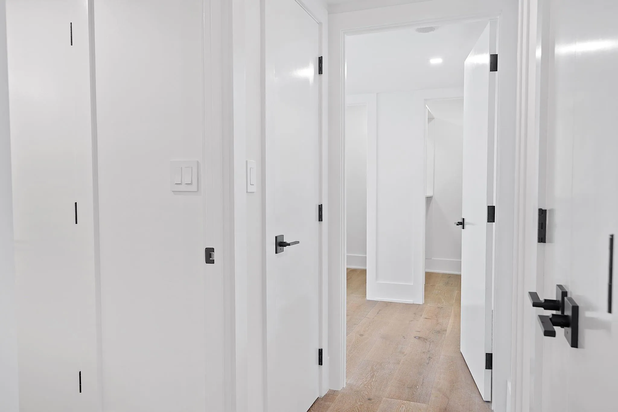 Hallway leading to 2 Bedrooms - All new Doors and hardware! Walk-in Closets