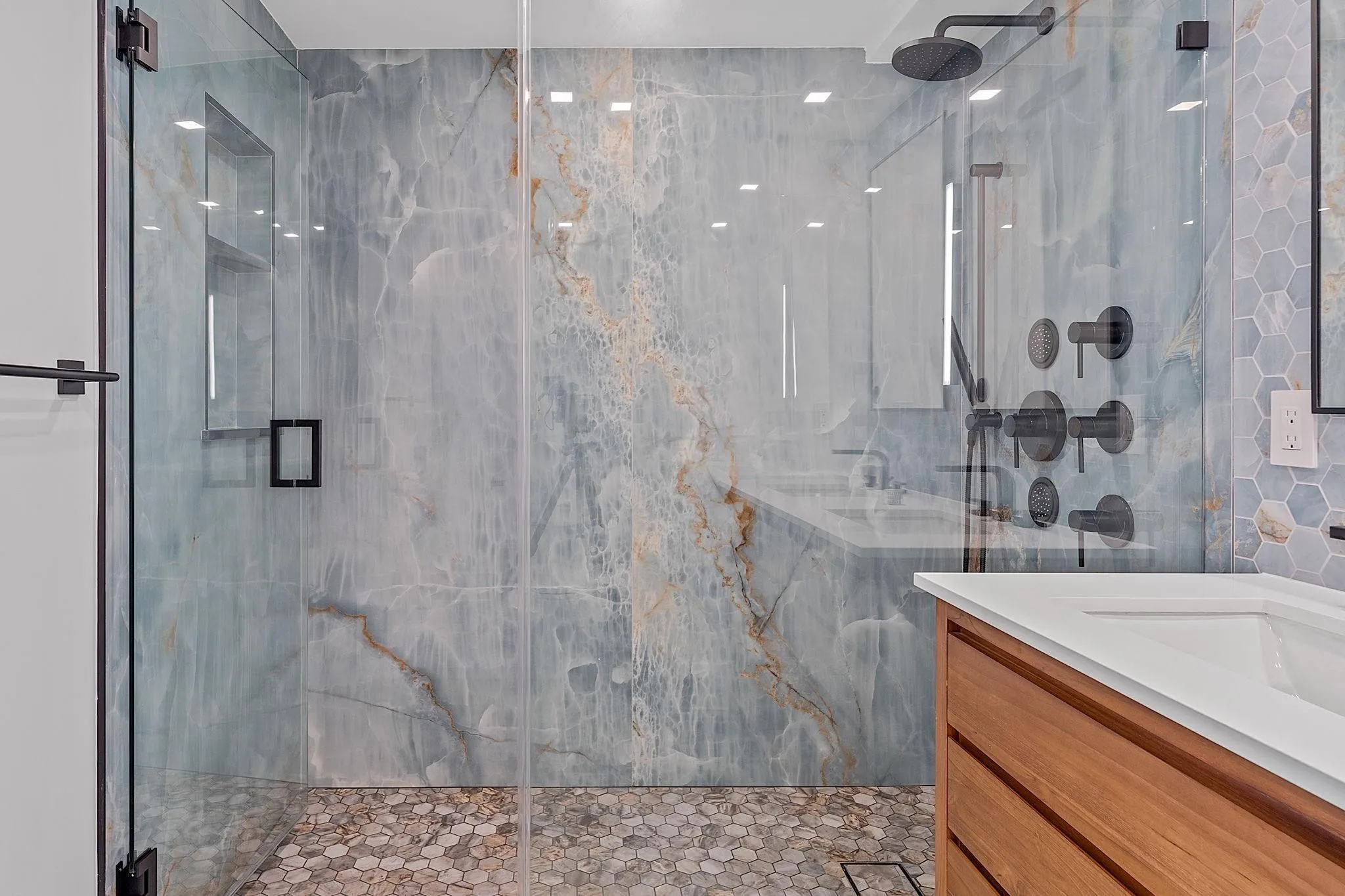 Master Bath Shower Floor to Ceiling Tiles and Glass Doors