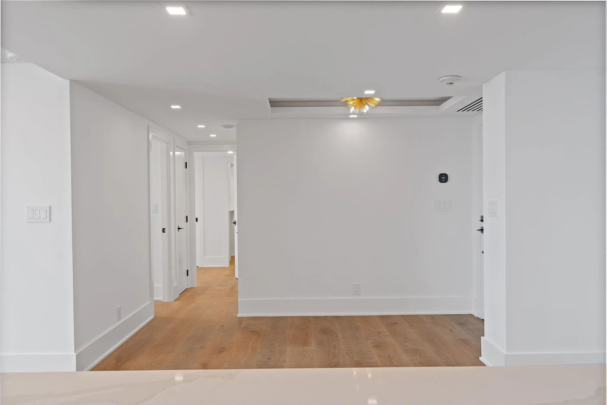 View from Kitchen to Dining Area and Entrance to Bedrooms