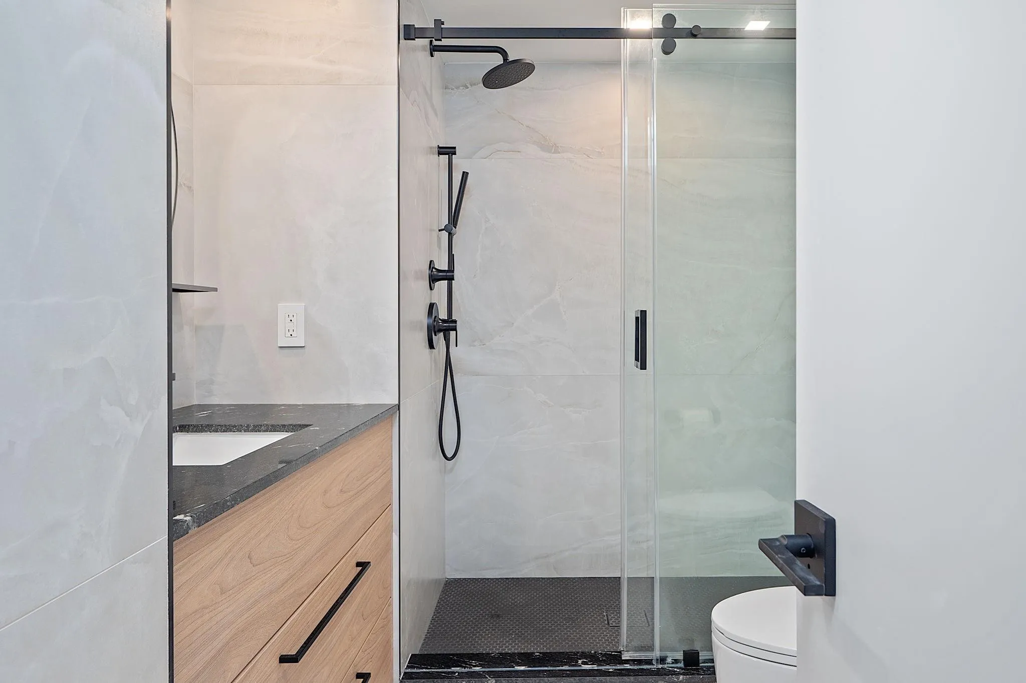Guest Bathroom with floor to ceiling tiles