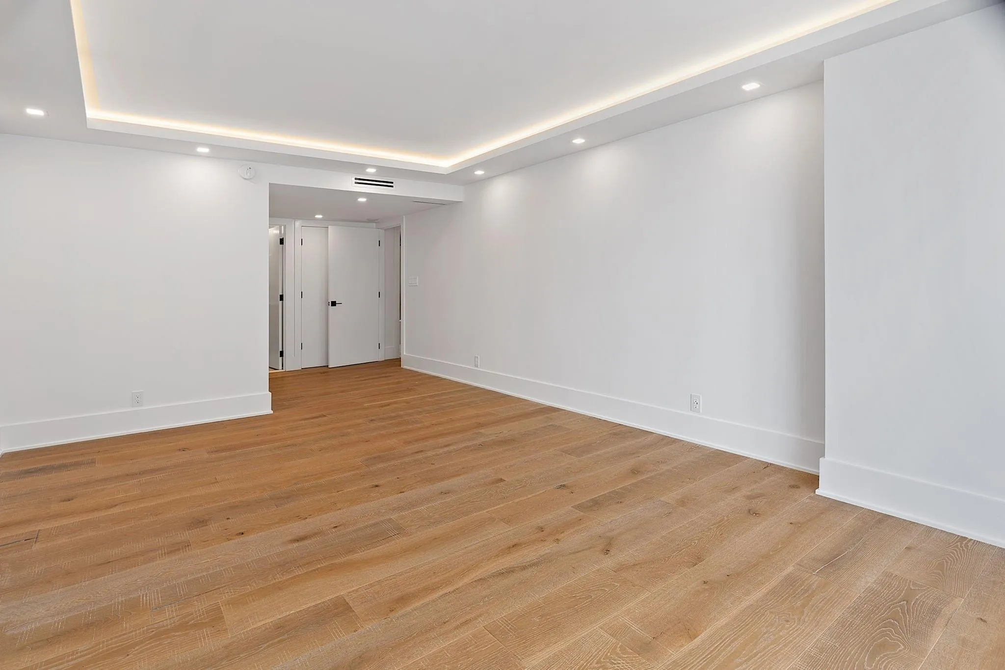 Tray Ceiling Lights, wood floors in Master Bedroom