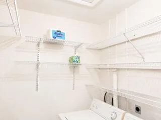 Laundry room with built-in shelving.