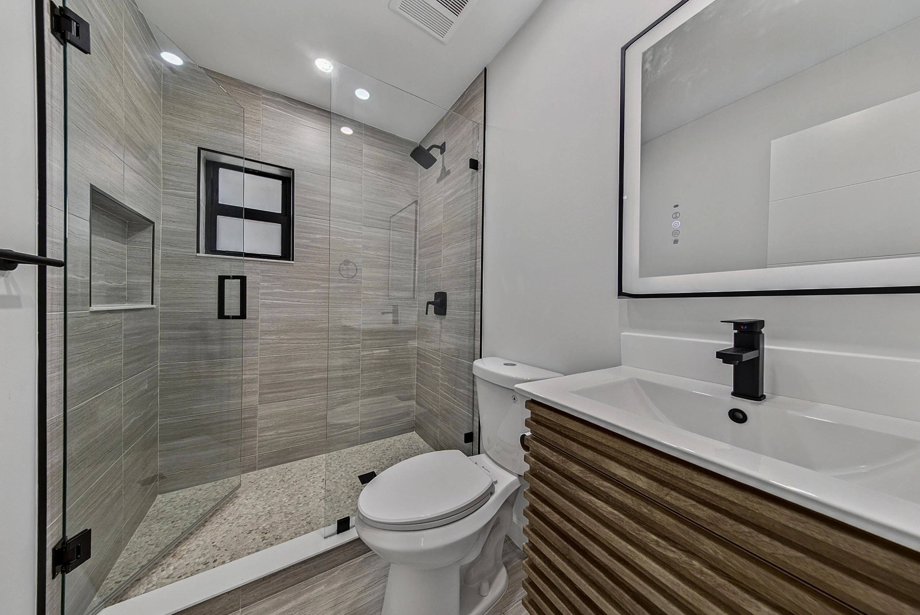 Spa inspired bath with stunning cabinet and shower.